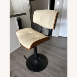 AllModern Wade Logan Cream Adjustable Swivel Bar Stool